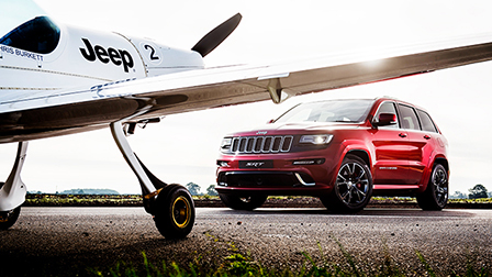 Jeep Grand Cherokee SRT vs a plane – an ultimate race!